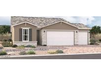 New home exterior featuring a three-car garage and desert landscaping at 18231 W Hess St, Goodyear, AZ 85338