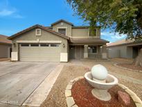 Two-story house with a landscaped yard and a water fountain at 2028 E Lipizzan Dr, San Tan Valley, AZ 85140