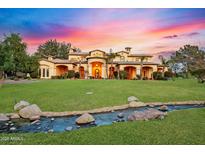 Elegant estate home featuring a meticulously manicured lawn and decorative water feature, perfect for luxury living at 21 E Oakwood Hills Dr, Chandler, AZ 85248