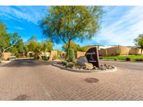 Grayhawk Pinnacle community entrance with gated entry and landscaped median at 21215 N 75Th St, Scottsdale, AZ 85255