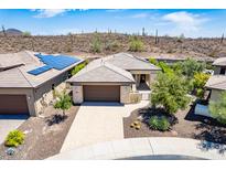 Beautiful single-story home with desert landscaping and a paver driveway in a vibrant community at 30343 N 130Th Dr, Peoria, AZ 85383