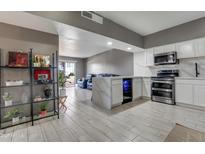 Open concept kitchen and living area, modern design at 355 E Thomas Rd # B206, Phoenix, AZ 85012