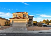 Two-story house with a two-car garage and desert landscaping at 3702 W Naomi Ln, San Tan Valley, AZ 85144