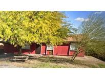 Ranch style home with a spacious front yard and mature tree at 4417 N 70Th Ave, Phoenix, AZ 85033