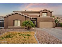 Two-story house with brown exterior, landscaping, and a two-car garage at 4647 E County Down Dr, Chandler, AZ 85249