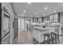 Spacious kitchen featuring granite countertops, modern appliances, and ample cabinet space for storage at 5249 E Thunderbird Rd, Scottsdale, AZ 85254