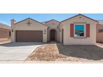 Charming single-story home featuring a two-car garage and a stucco exterior at 7659 W Cactus Wren Way, Florence, AZ 85132