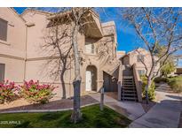 Attractive condo building exterior with landscaping and walkway at 15380 N 100Th St # 1096, Scottsdale, AZ 85260