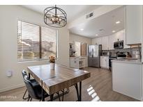 Updated kitchen with eat-in dining area and modern lighting at 15380 N 100Th St # 1096, Scottsdale, AZ 85260