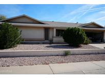 Single-story house with a well-maintained front yard and a two-car garage at 17407 N Country Club N Dr, Sun City, AZ 85373