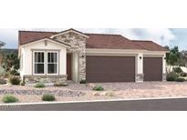 Craftsman style home with three-car garage and red tile roof at 18219 W Hess St, Goodyear, AZ 85338