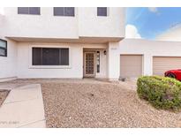 Two-story stucco home with attached garage and landscaped front yard at 2535 W Canyon Crest Cir, Phoenix, AZ 85023