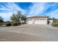 Two-story home with attached garage and desert landscaping at 26846 N 73Rd St, Scottsdale, AZ 85266