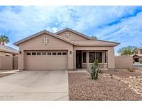 Charming single-story home featuring a two-car garage and desert landscaping at 3711 E Sandy Way, Gilbert, AZ 85297