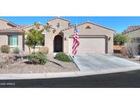 Single-story home with two-car garage and landscaped front yard at 5845 N Turquoise Ln, Eloy, AZ 85131