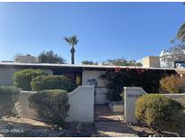 Ranch style home with gated entry and desert landscaping at 6124 N 130Th Ave, Litchfield Park, AZ 85340