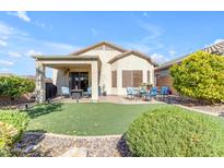 Covered patio, grassy area, and a built-in grill at 7325 W Pleasant Oak Way, Florence, AZ 85132