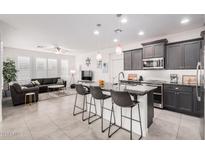 Modern kitchen with granite countertops and stainless steel appliances at 880 E Verde Blvd, Queen Creek, AZ 85140