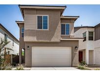 Charming two-story home featuring a spacious garage, complemented by well-maintained landscaping and a neutral color palette at 9358 E Sequence Ave, Mesa, AZ 85212
