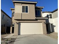 Two-story house with attached garage and neutral color scheme at 9358 E Sequence Ave, Mesa, AZ 85212