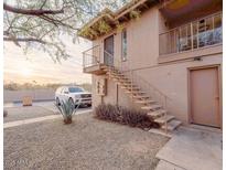 Building exterior with stairs, landscaping, and parking at 14806 N Yerba Buena Way # D, Fountain Hills, AZ 85268