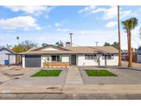 Remodeled mid-century home with new landscaping and driveway at 1890 E Palmcroft Dr, Tempe, AZ 85282