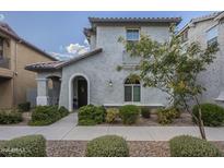 Two-story stucco home with arched entryway and landscaping at 3910 E Turley St, Gilbert, AZ 85295
