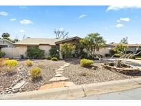 Charming single-story home with stone pathway and desert landscaping at 4301 E Montecito Ave, Phoenix, AZ 85018