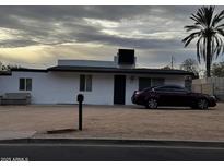 Charming single-story home featuring a mailbox, a parked car, and desert landscaping at 9618 N 9Th Ave, Phoenix, AZ 85021