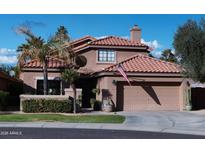 Beautiful two-story home with tile roof and landscaped yard at 15435 N 51St St, Scottsdale, AZ 85254