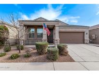 Single-story home with two-car garage and landscaped yard at 1631 N Beverly --, Mesa, AZ 85201