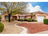 Single-story house with landscaped yard and two-car garage at 20811 N 148Th Dr, Sun City West, AZ 85375