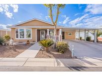 Tan single-story home with carport and landscaped yard at 2263 N Trekell Rd, Casa Grande, AZ 85122