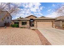 Single-story home with desert landscaping and two-car garage at 29590 N Balmoral Pl, San Tan Valley, AZ 85143