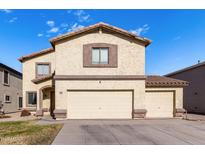 Two-story house with a large garage and well-maintained lawn at 4322 E Whitehall Dr, San Tan Valley, AZ 85140