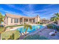 Home with sparkling pool and desert landscaping at 4329 E Swilling Rd, Phoenix, AZ 85050