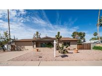 Single story home with a landscaped front yard, and two-car garage at 8514 E Fairmount Ave, Scottsdale, AZ 85251