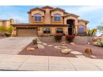 Two story home with landscaped yard and driveway at 14829 N 18Th Pl, Phoenix, AZ 85022