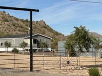 Mobile home with fenced yard and mountain views at 2363 W Daniel Rd, Queen Creek, AZ 85144