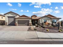 Beautiful single-story home featuring a well-maintained yard and a three-car garage, providing ample parking space at 31419 N 41St Pl, Cave Creek, AZ 85331