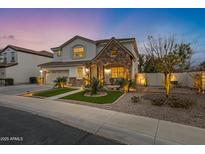 Two-story house with stone accents and landscaped front yard at 4103 E Mead Way, Chandler, AZ 85249