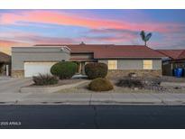 Single-story home with a terracotta tile roof and landscaped front yard at 500 E Encinas Ave, Gilbert, AZ 85234