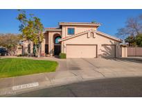 Two-story house with a two-car garage and landscaped front yard at 10921 W Bermuda Dr, Avondale, AZ 85392