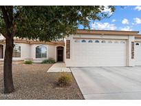 Inviting exterior with a two-car garage and well-manicured landscaping at 10960 E Monte Ave # 196, Mesa, AZ 85209