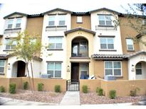 Modern townhome featuring a private front patio, neutral-toned exterior, and multiple windows for ample natural light at 1255 N Arizona Ave # 1297, Chandler, AZ 85225