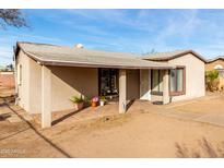 Ranch style home with front porch and mature landscaping at 3640 W Garfield St, Phoenix, AZ 85009