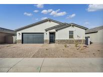 Charming single-story home featuring a gray color scheme, stone accents, and a well-maintained front yard at 5030 W Hunter Trl, San Tan Valley, AZ 85144