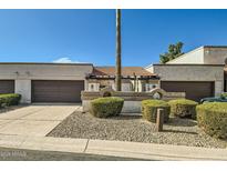 Spanish style home with two-car garage and landscaped front yard at 7313 E Pleasant E Run, Scottsdale, AZ 85258