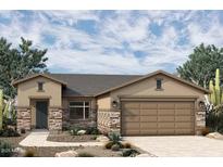 Single-story home with stone accents and a two-car garage at 19315 W Luke Ave, Litchfield Park, AZ 85340