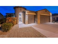 Attractive single-story home with two-car garage and desert landscaping at 26063 N 83Rd Dr, Peoria, AZ 85383